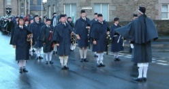 Click to enlarge - the image shows the  Pipe Band on Hillhead, with the  2003 Jarl Squad in the background.