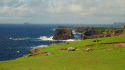   The cliffs of Eshaness, Northmavine (the local name for 'North Mainland'), with Muckle Ossa in the distance.